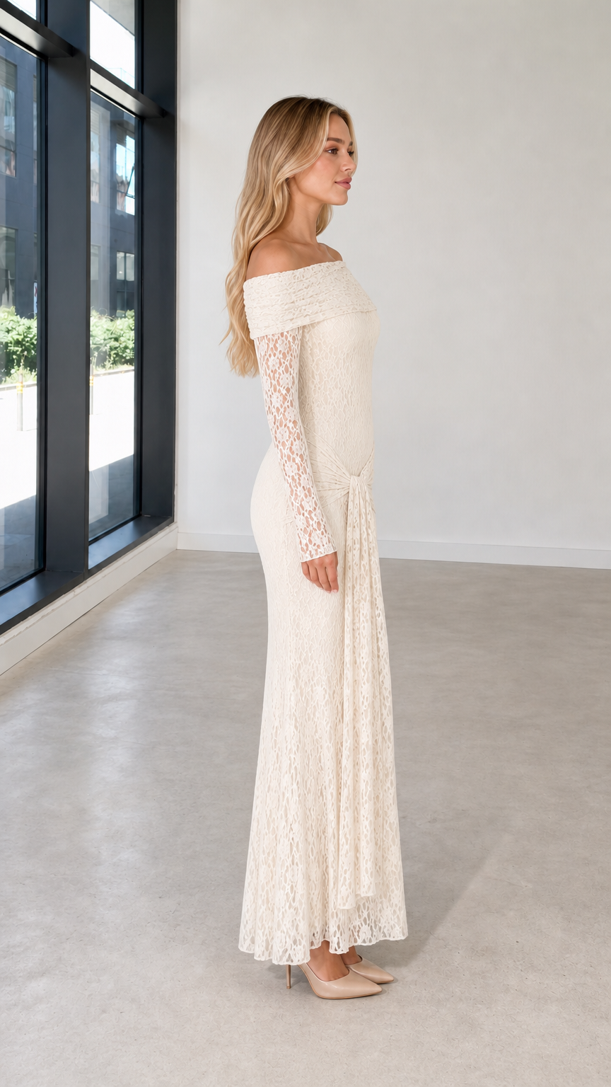 Side profile view of ivory lace evening dress