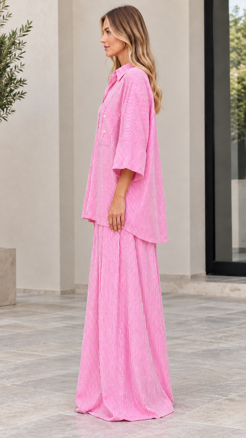 Side view of woman wearing pink vertical striped matching two-piece set