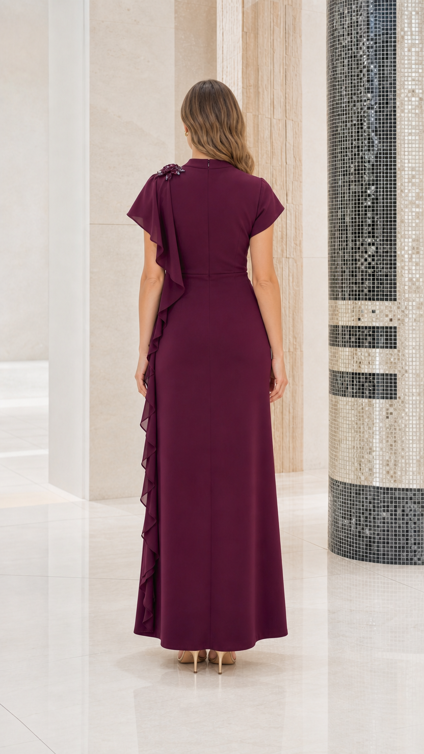 Back view of woman wearing burgundy mock neck formal gown showing smooth back fit