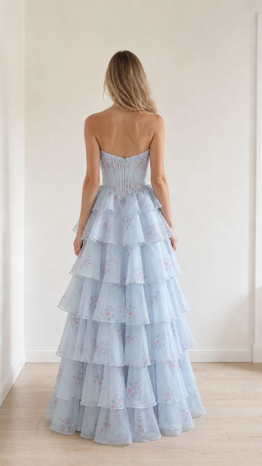 Back view showcasing structured corset back of light blue gown