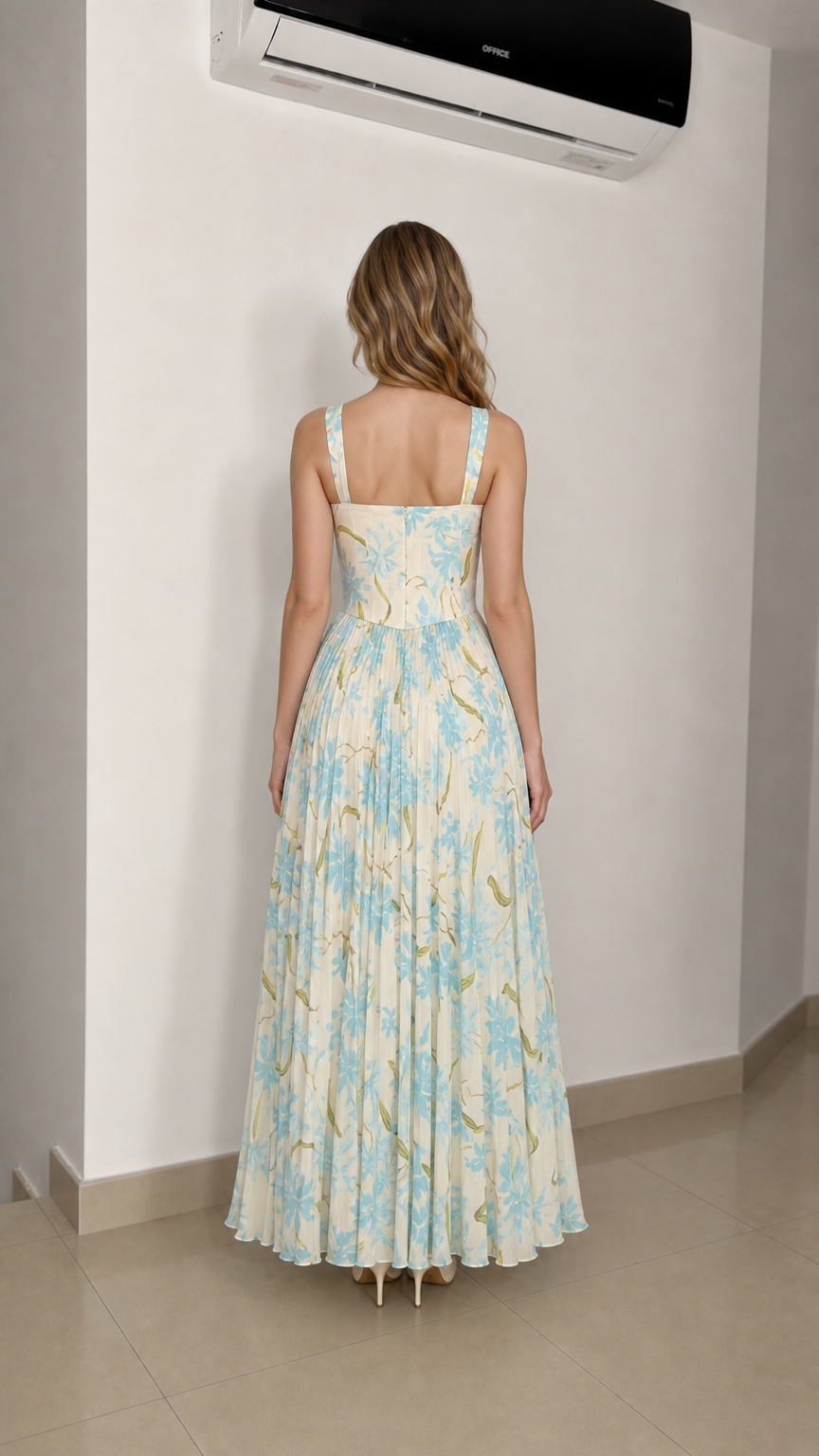 Model wearing ivory floral maxi dress from the back