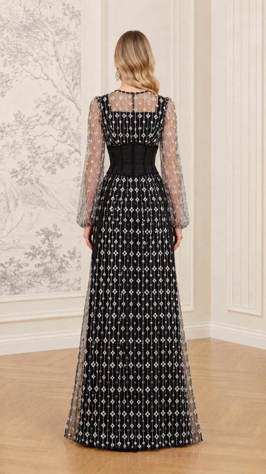 Back view of black long sleeve formal gown with sheer back yoke and full-length skirt