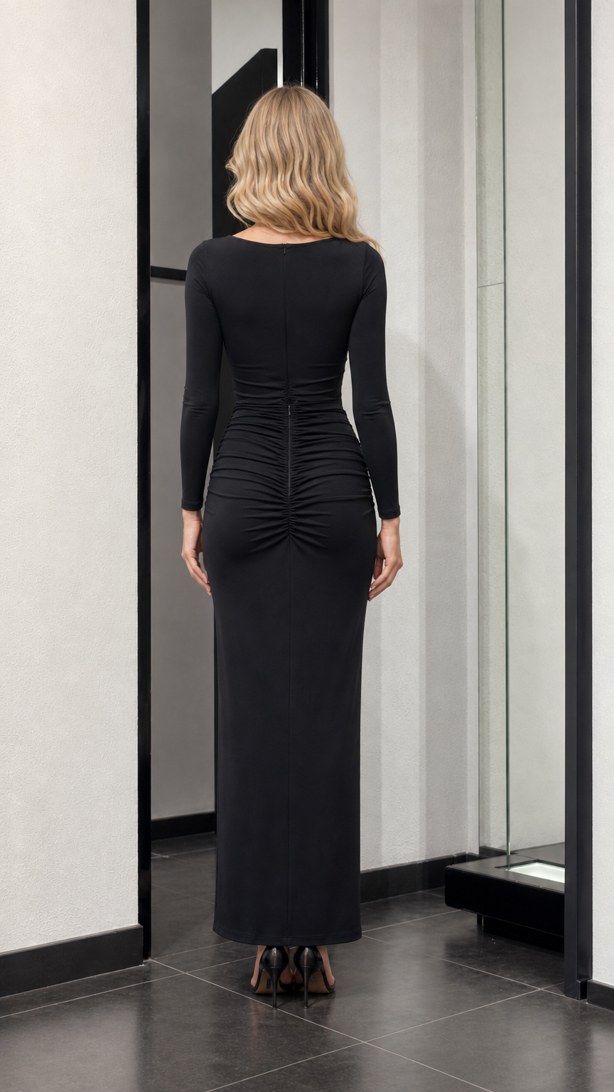 Back view of black maxi dress showing ruching detail