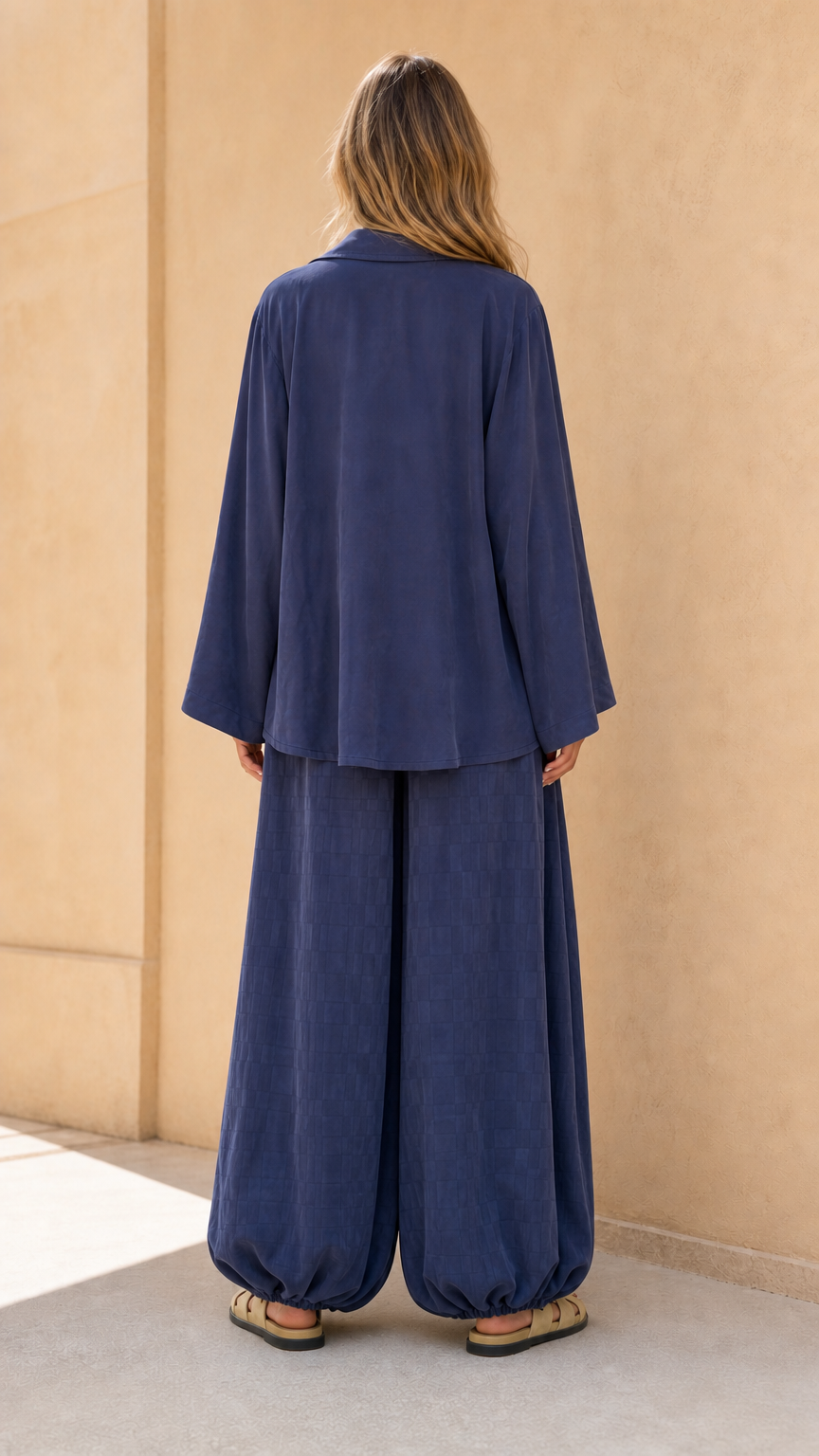 Back view of model in navy matching set
