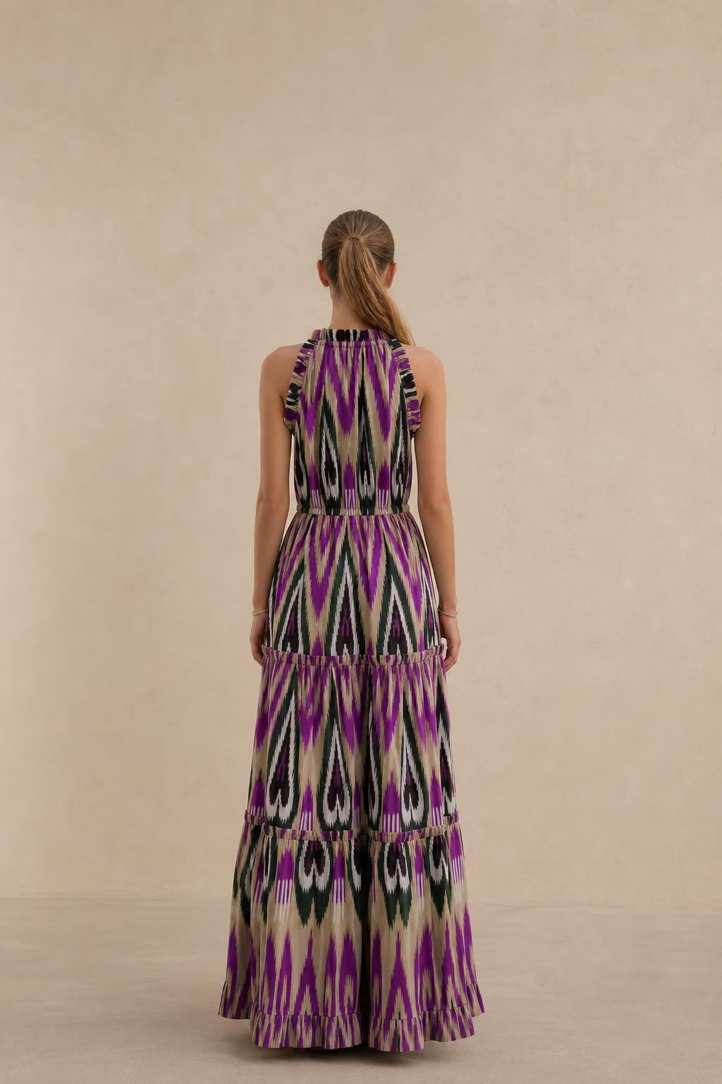 Back view of model in purple multi ikat print maxi dress
