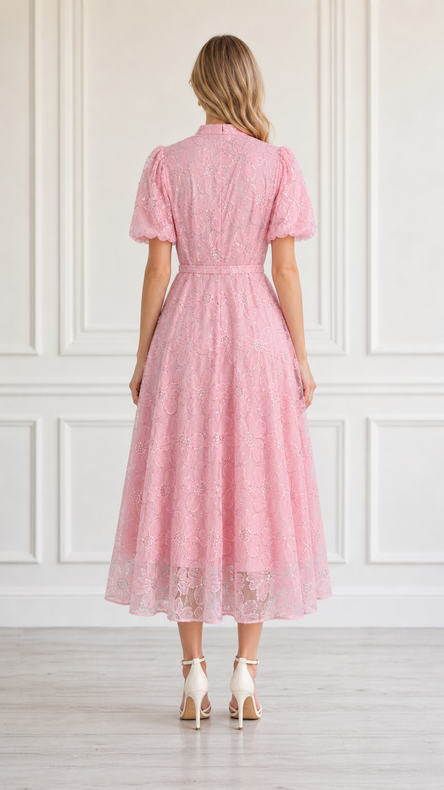 Back view of model in pink midi dress