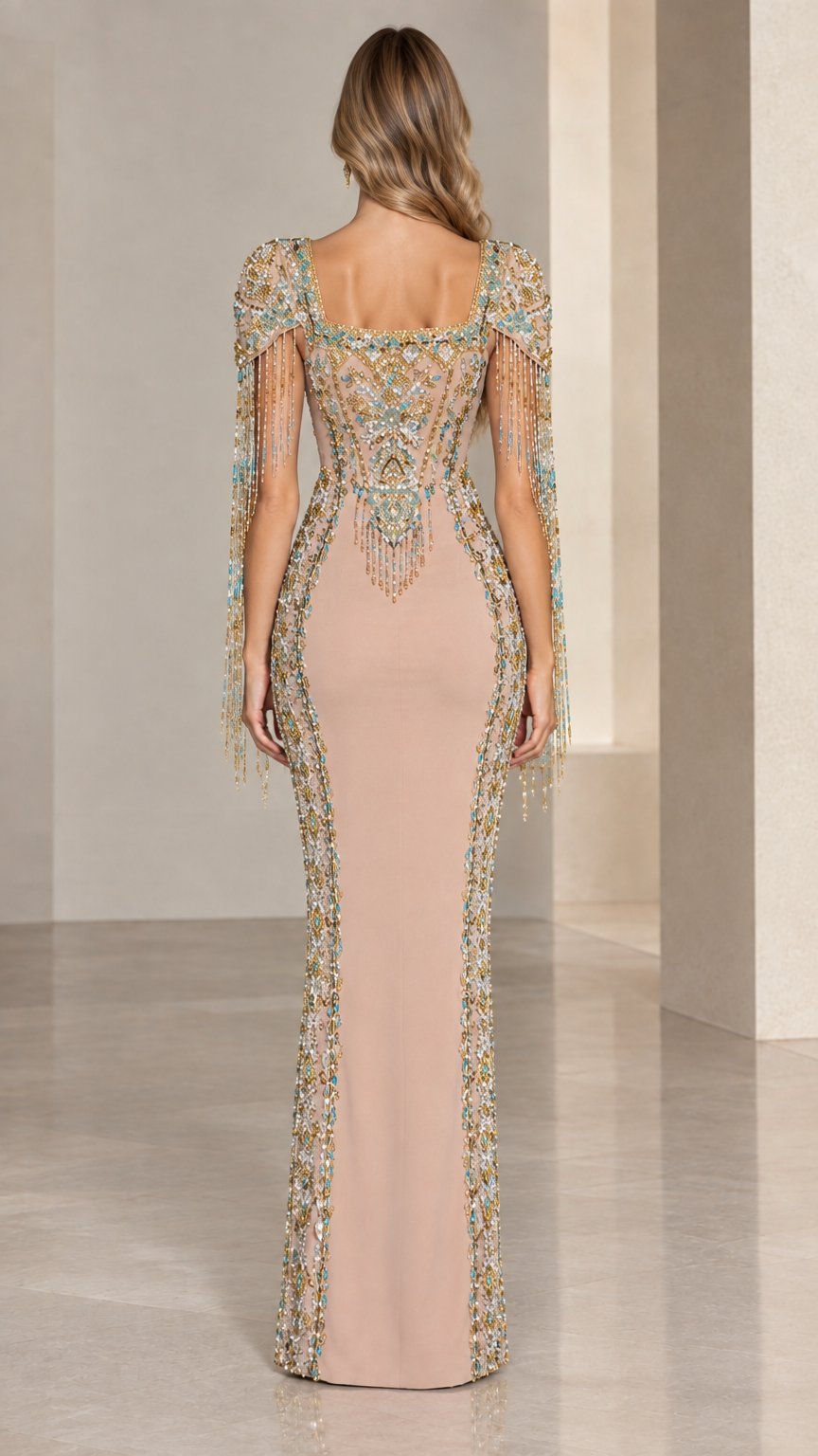 Back view of model in Nude embellished evening gown showcasing back beadwork and fringe details