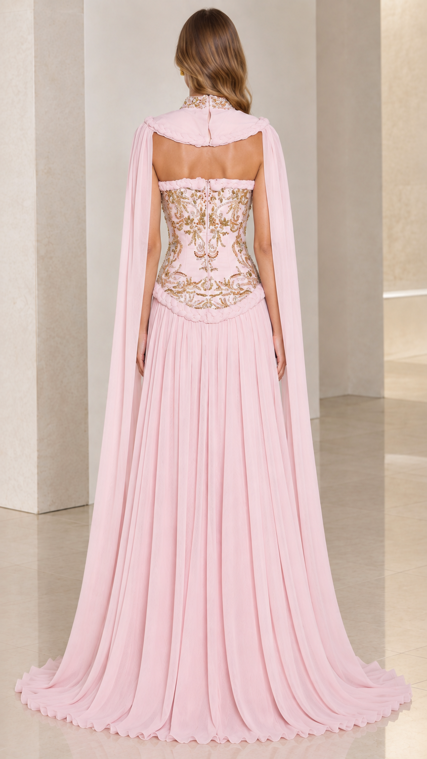 Back view of blush pink strapless gown with trailing sheer cape