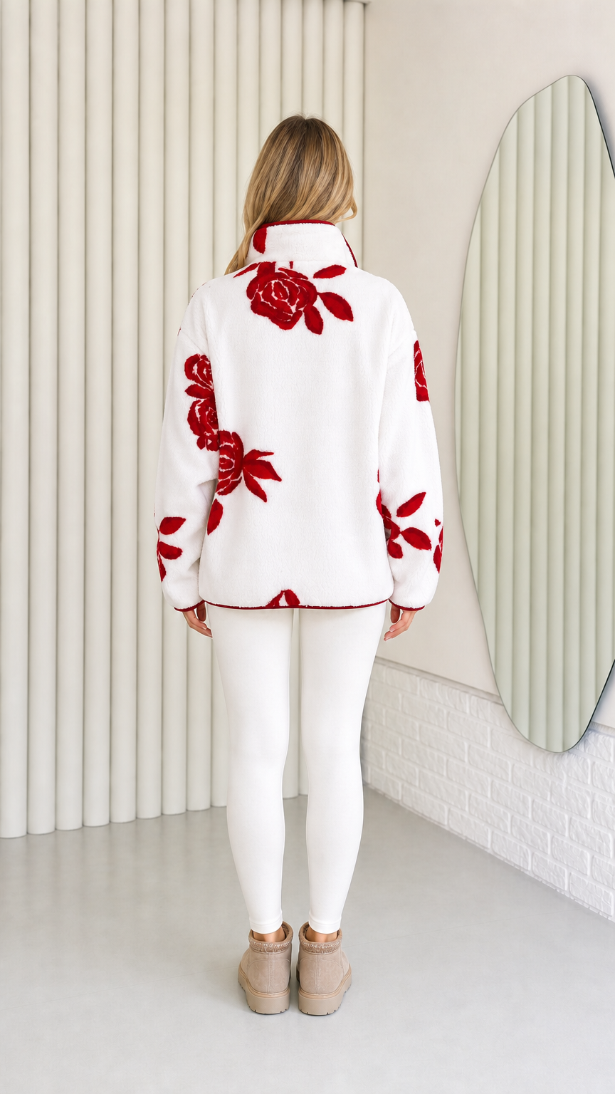 Back view of model wearing white and red floral plush fleece jacket