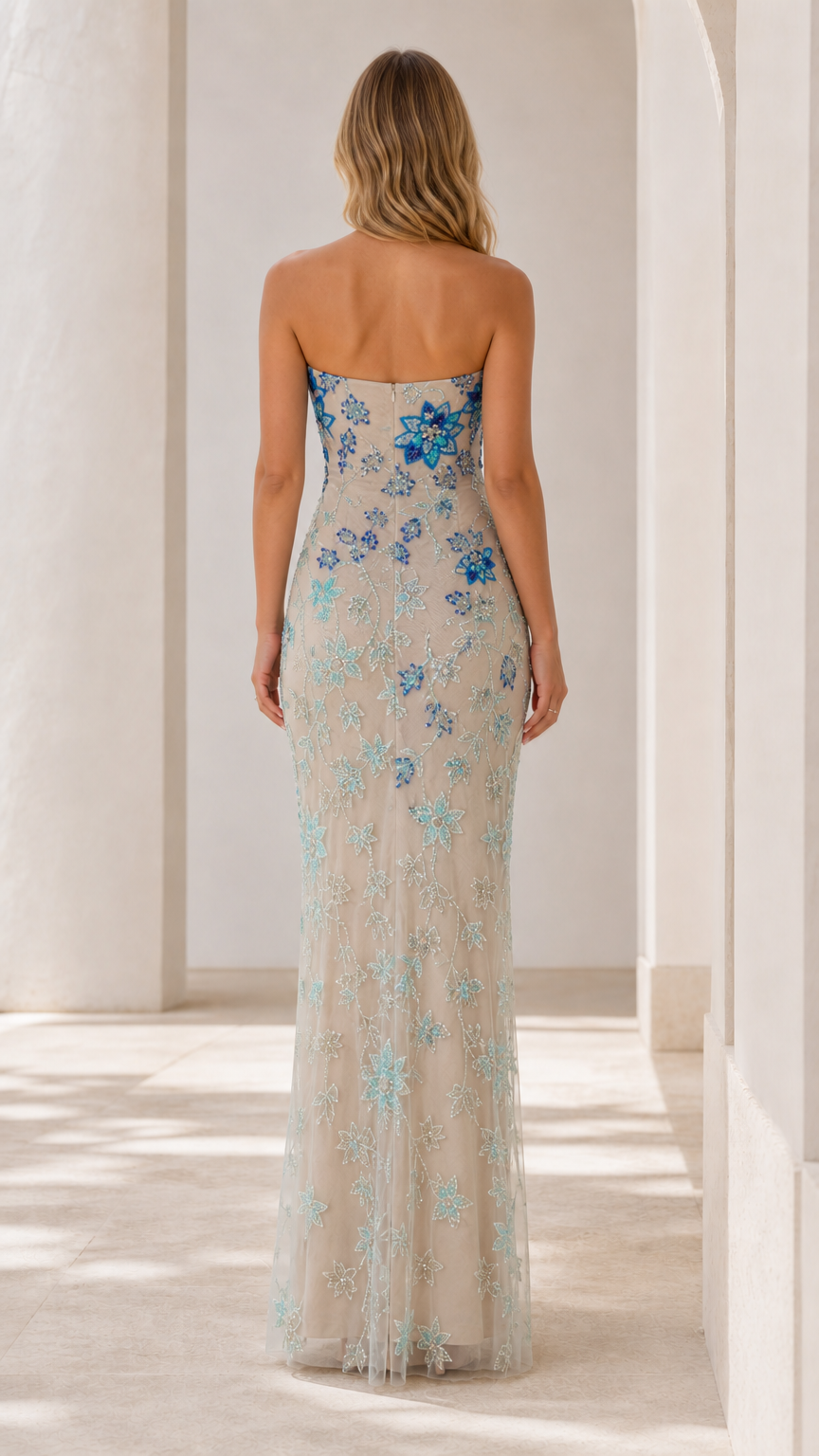 Back view of champagne strapless column gown with blue beading