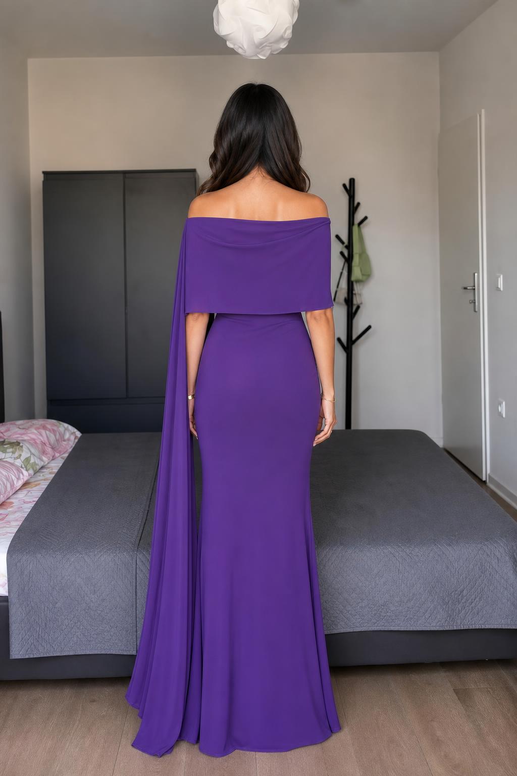 Model wearing purple off-shoulder cape maxi dress back view