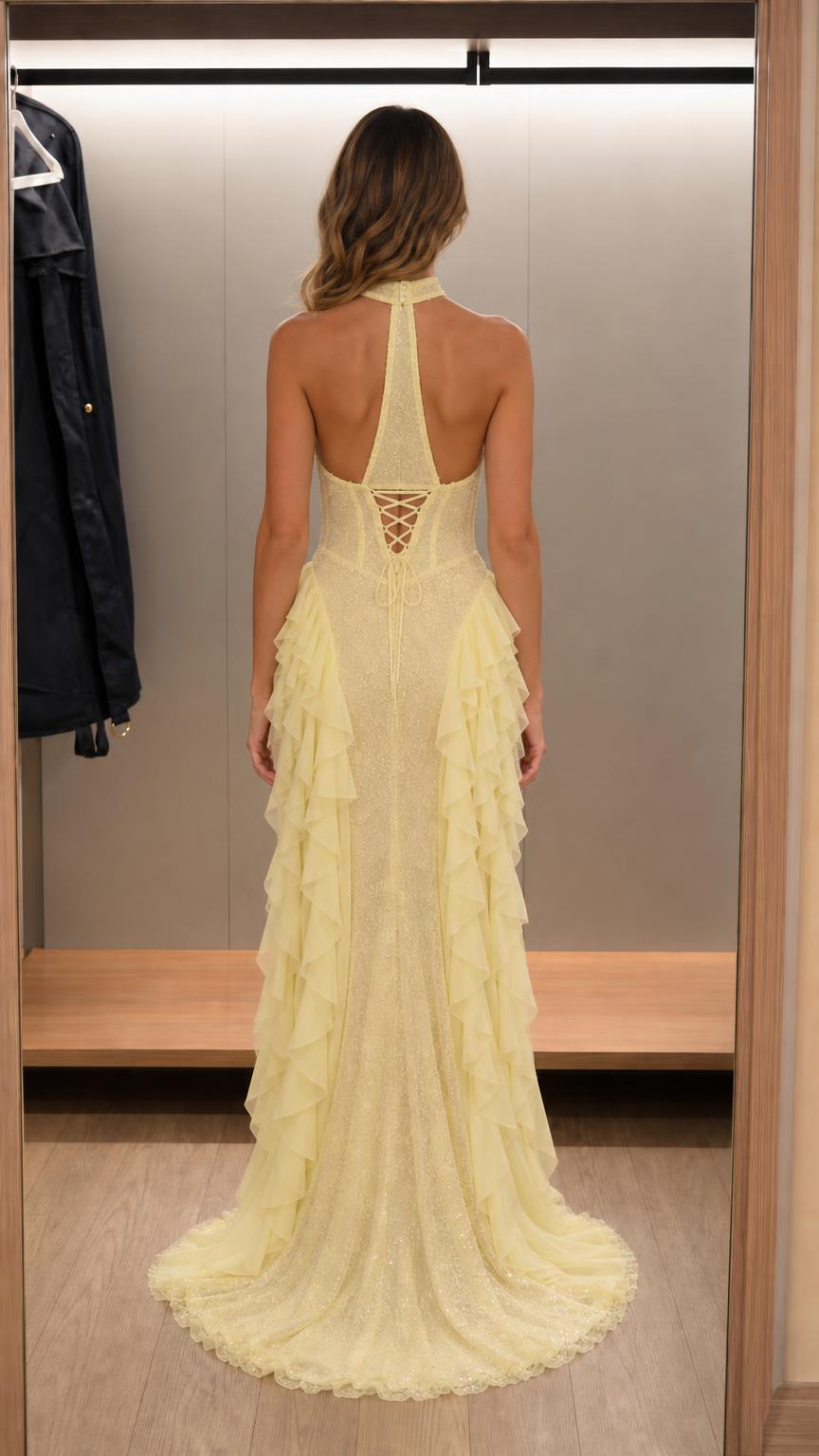 Back view showing lace-up corset detail of yellow maxi dress