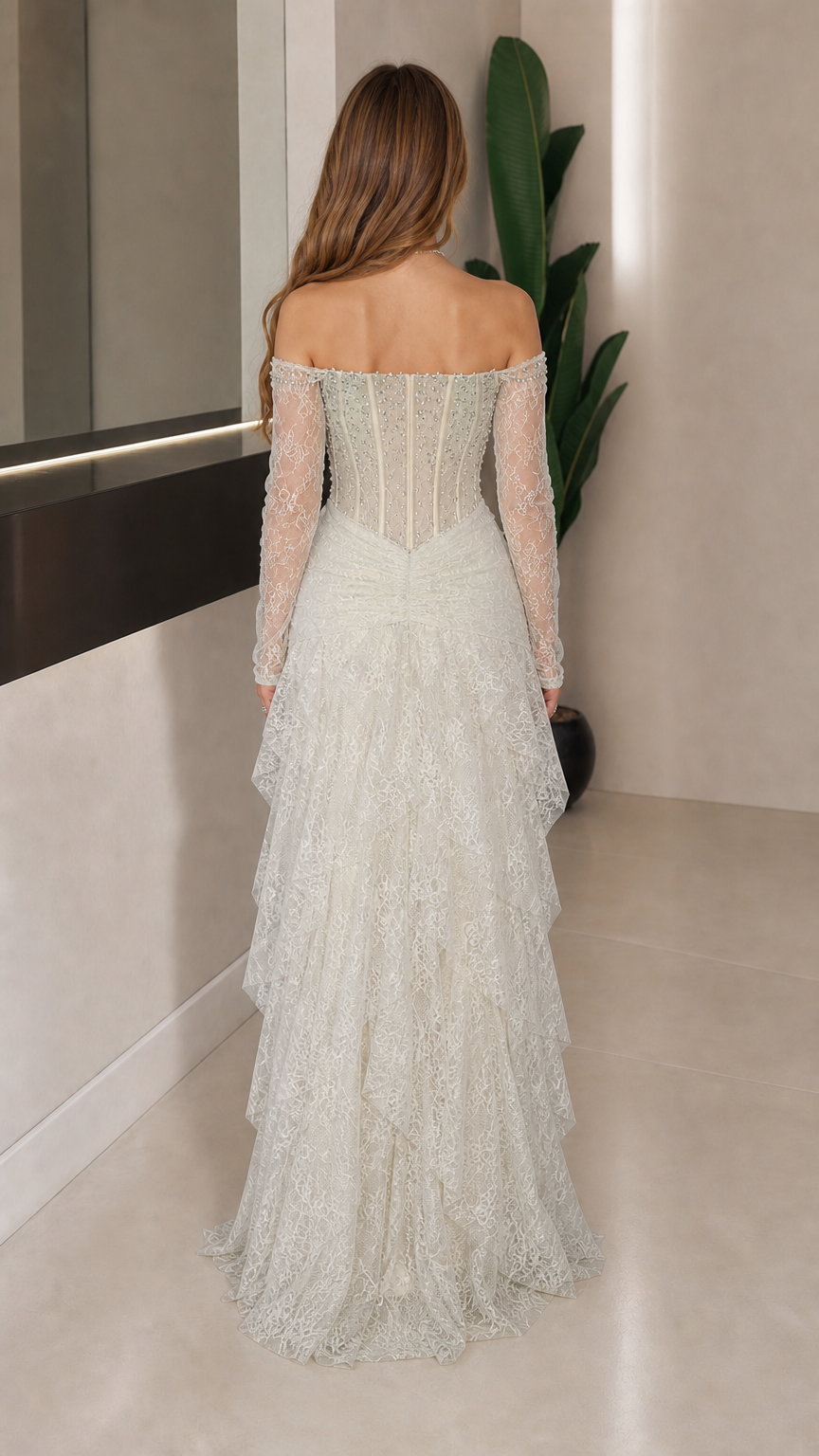 Back view of white tiered lace evening gown
