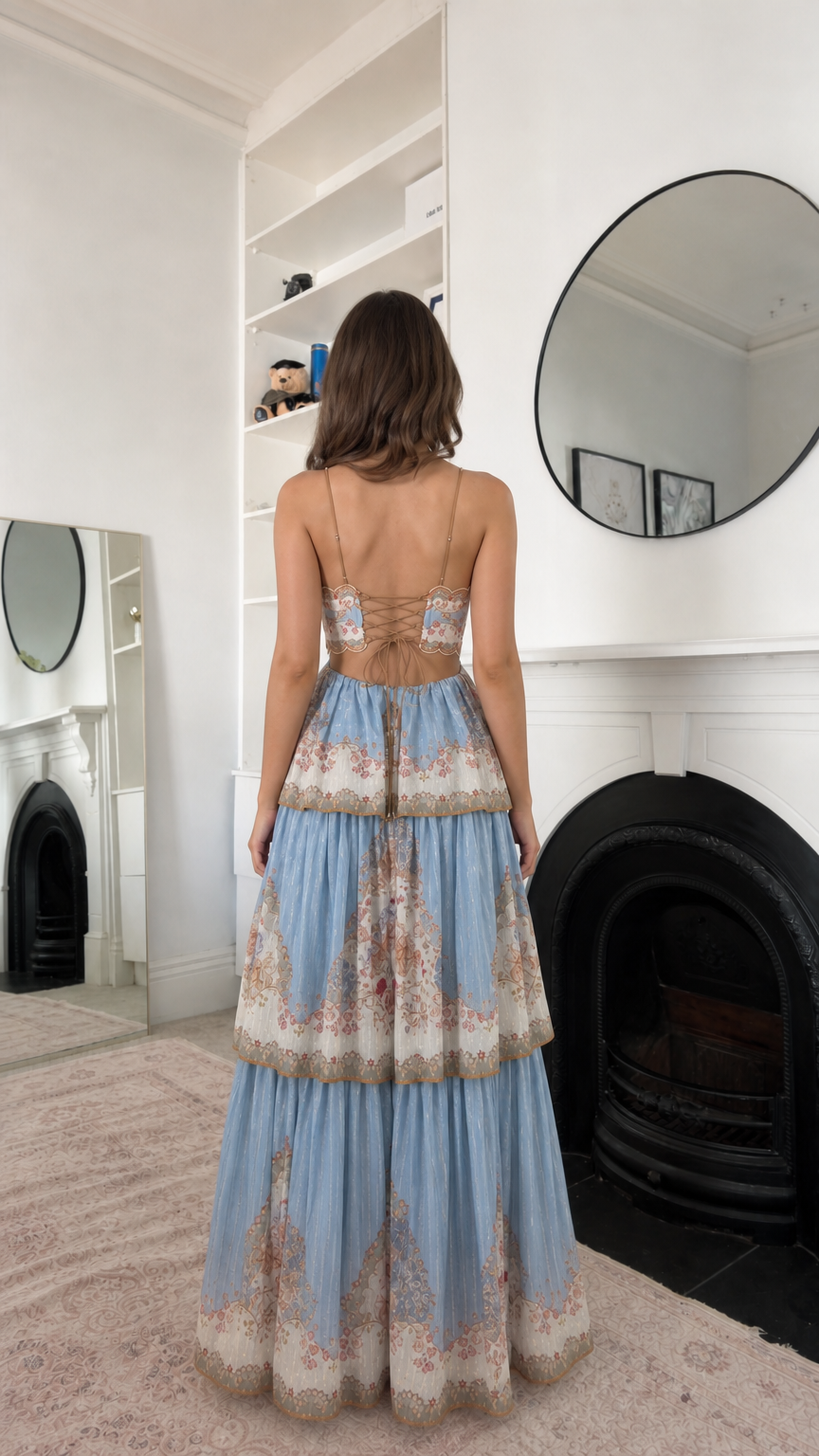 Sky blue floral maxi dress showing the open back and tiered skirt