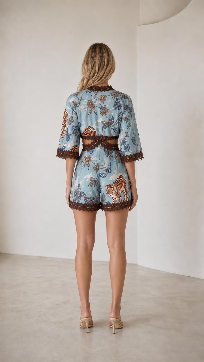 Back view of light blue printed crop top and shorts set