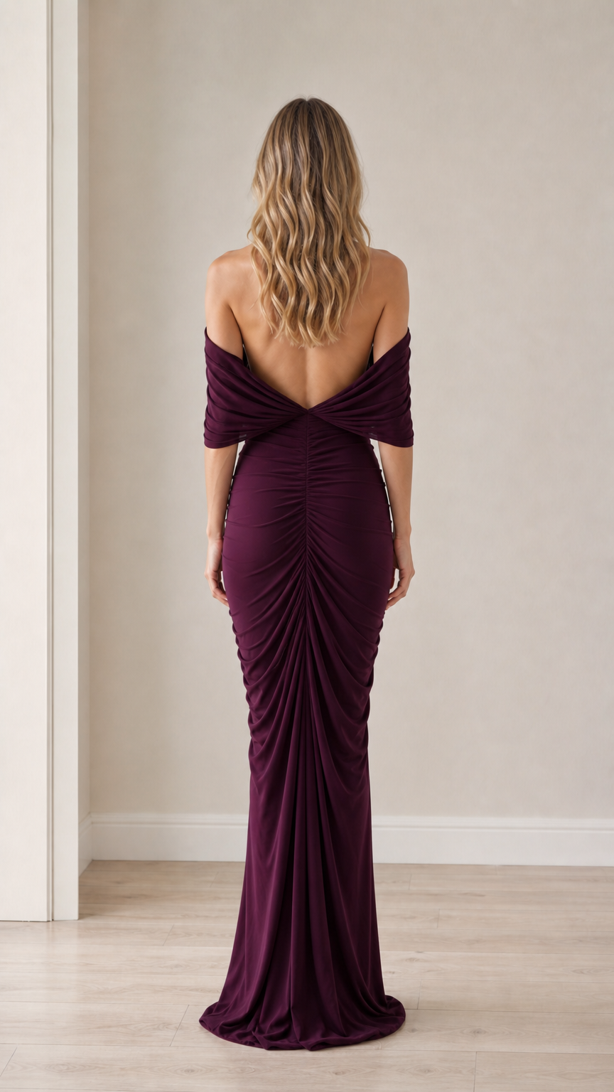 Back view showcasing the open back and draping