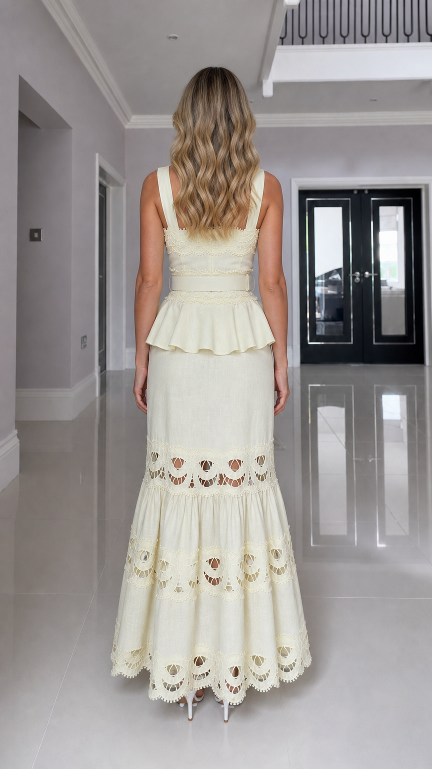 Back view of model in yellow cutout maxi dress