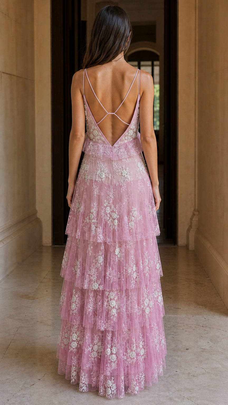 Back view showing cross-straps on pink maxi dress