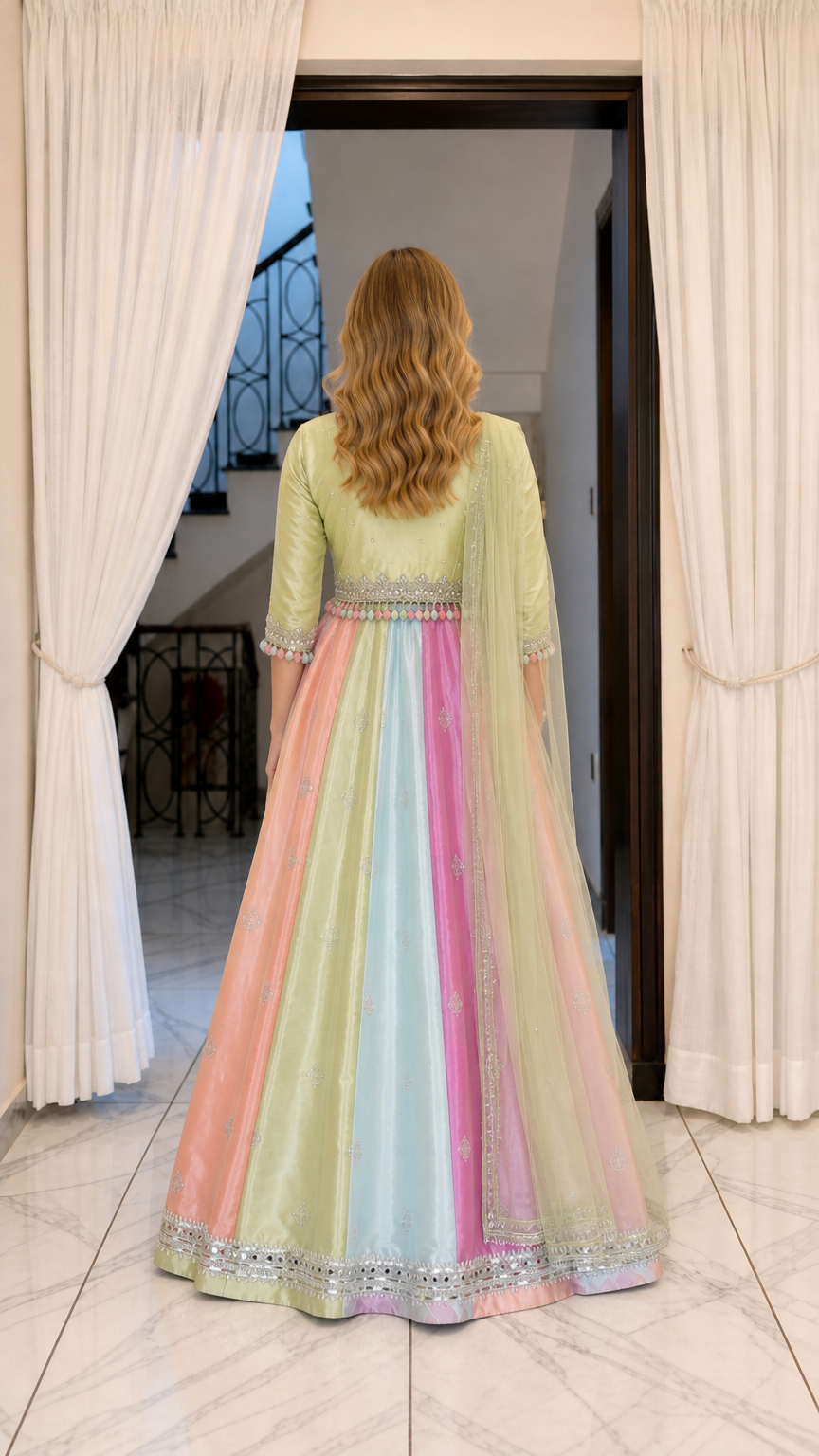 Back full-length view of pastel multicolor panel Anarkali dress showing dramatic skirt flare