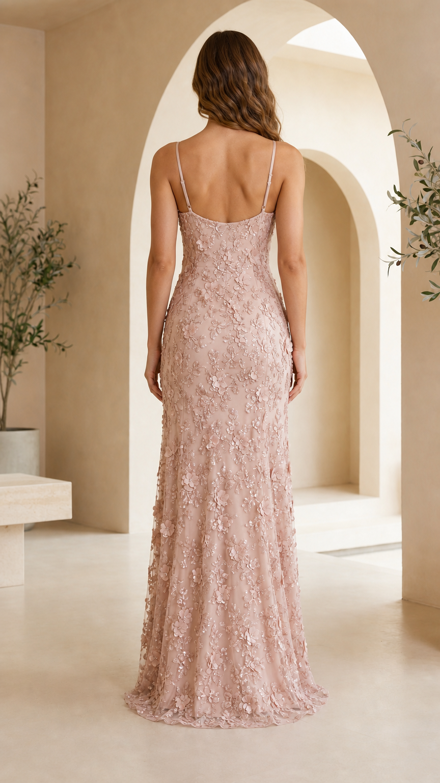 Back view of model wearing dusty pink spaghetti strap low-back formal gown