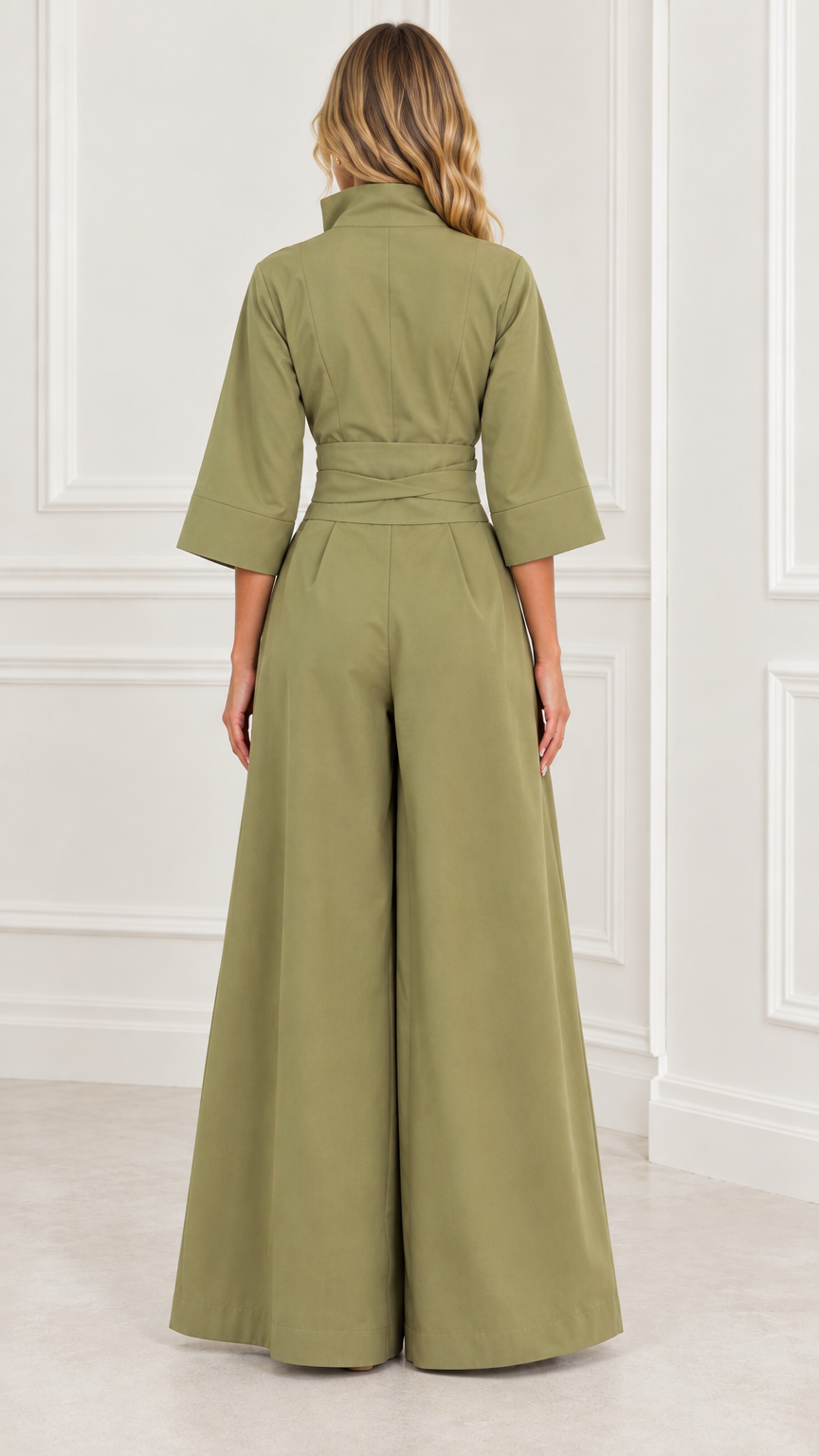 Back view of woman wearing an olive green wide-leg jumpsuit