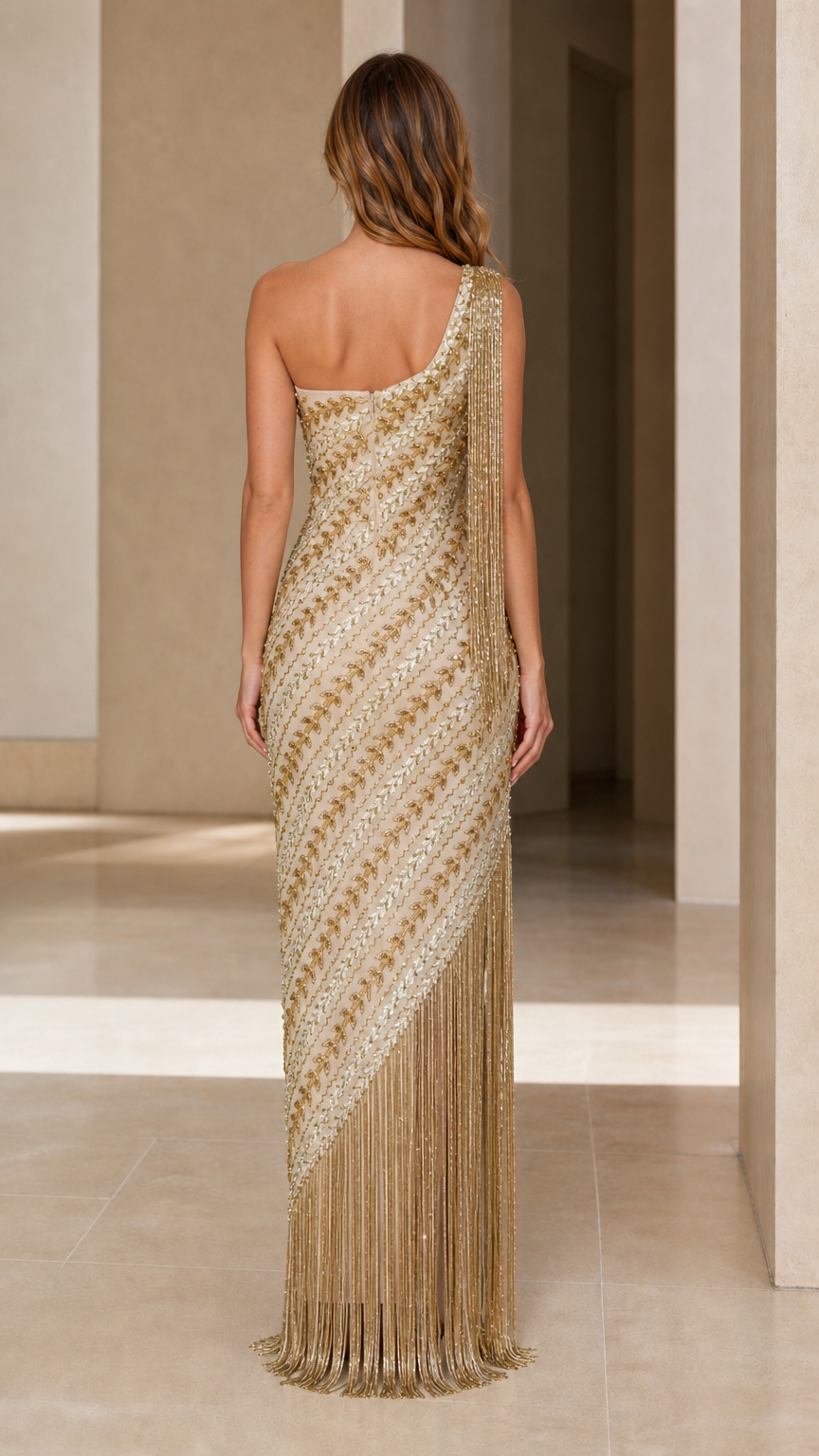 Back view of champagne gold sequined one-shoulder maxi gown