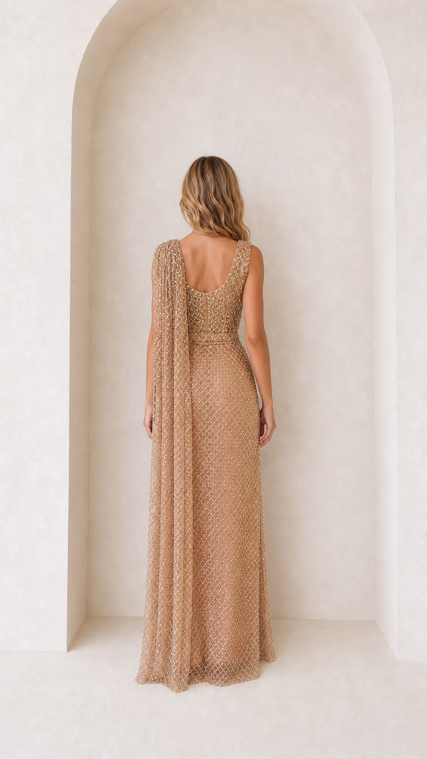 Back view of Champagne Gold pre-draped saree gown showing flowing shoulder drape