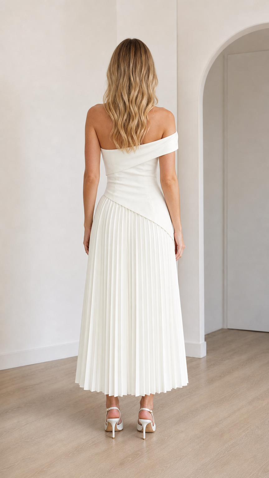 Back view of model in white off-shoulder midi dress