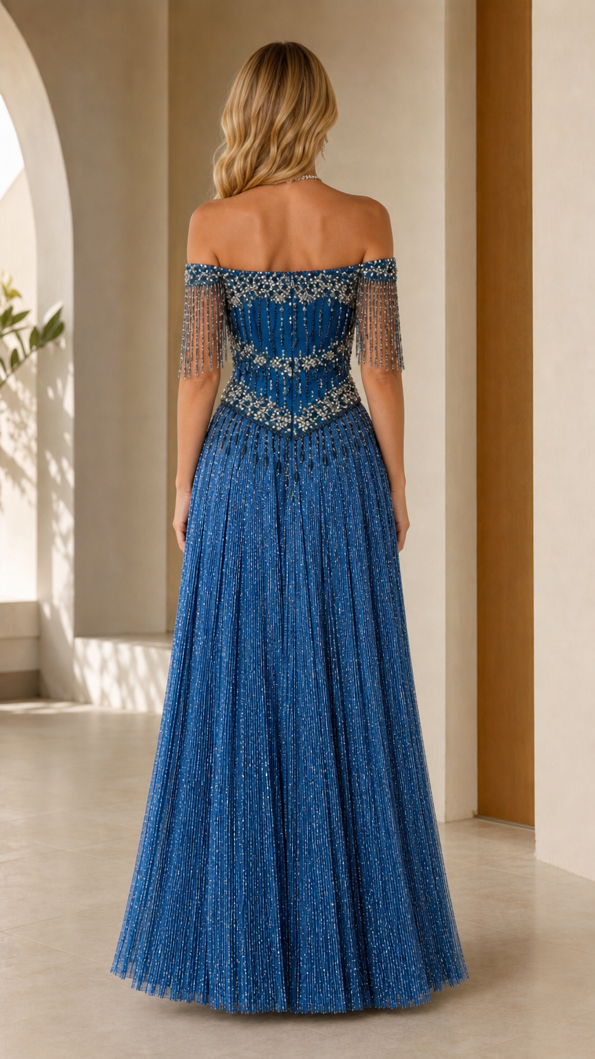 Back view of royal blue off-the-shoulder beaded evening gown