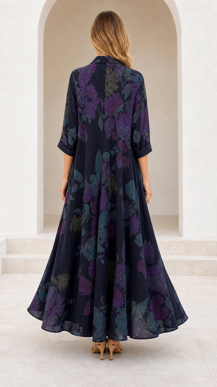 Back view of model in Navy Blue floral print maxi dress