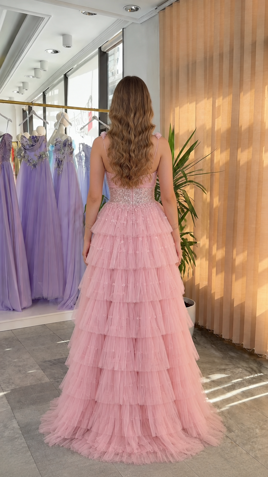 Back view of pink tiered ruffle tulle formal gown