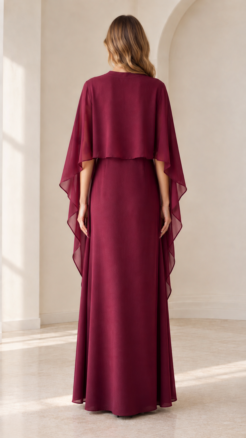 Back view of burgundy capelet maxi dress showing draped cape