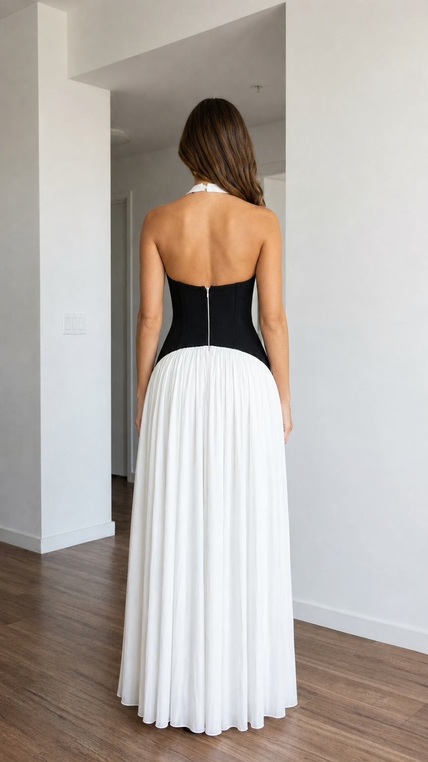 Back view of white halter pleated maxi dress