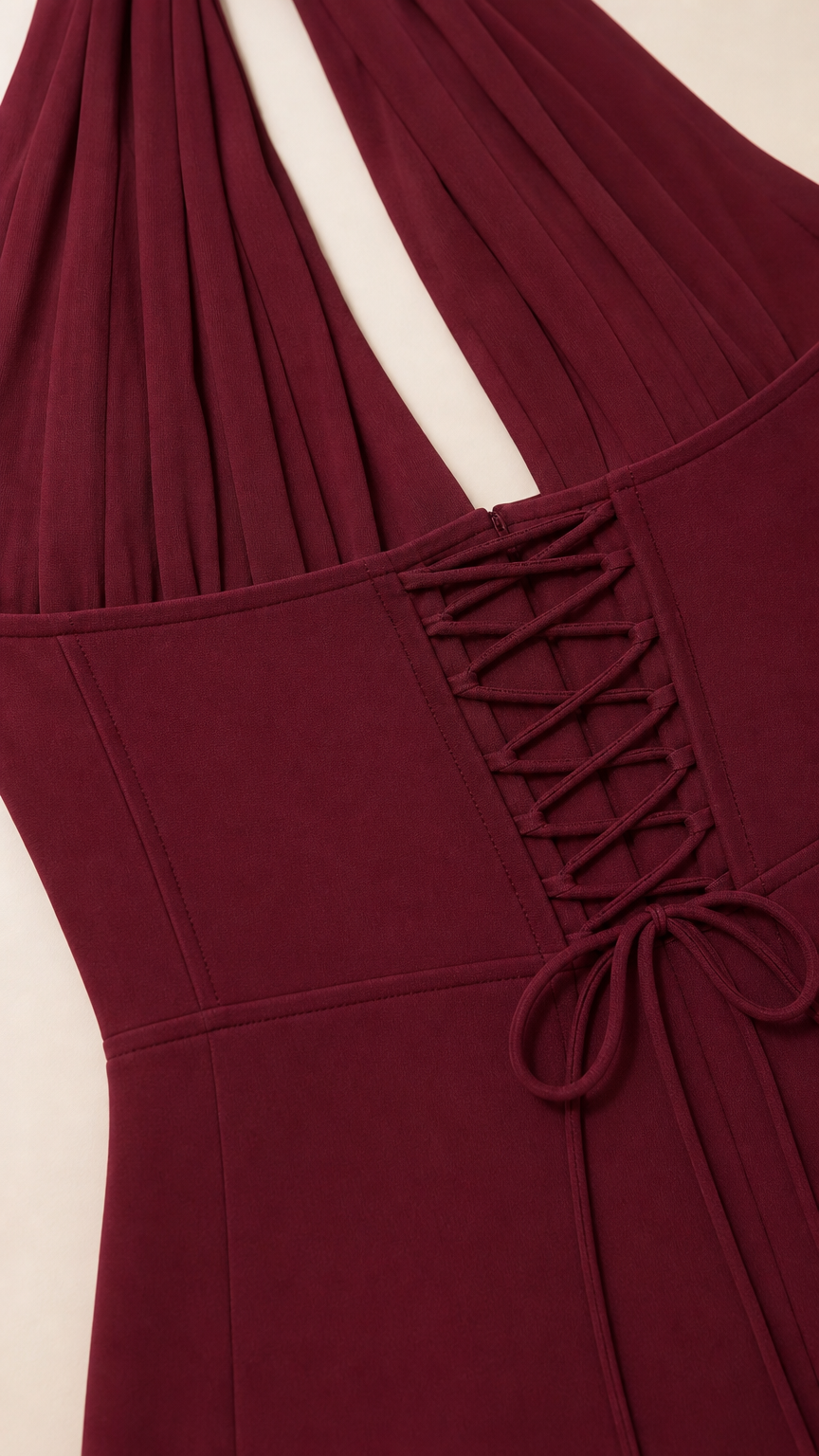 Close-up of lace-up corset back and halter neckline detail
