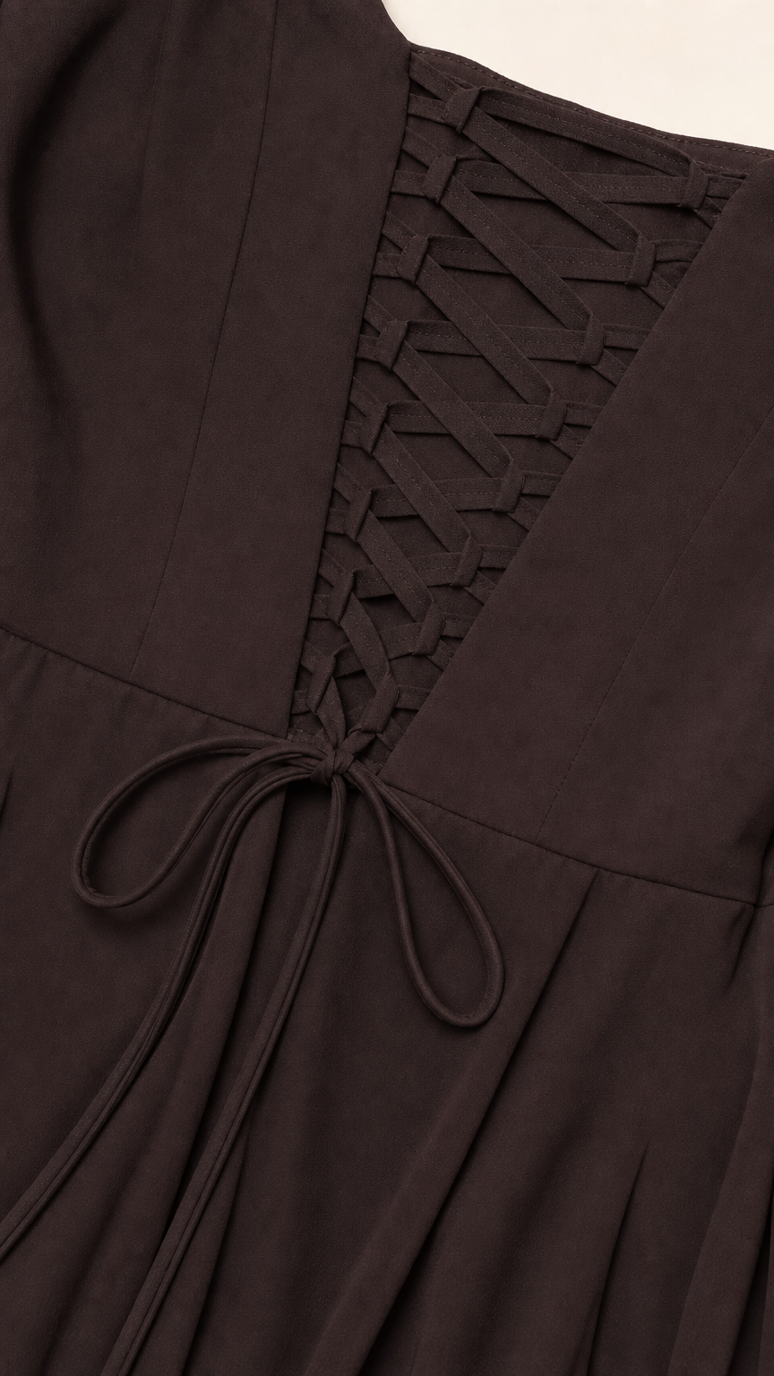Close-up detail of the adjustable lace-up corset back on chocolate brown formal dress