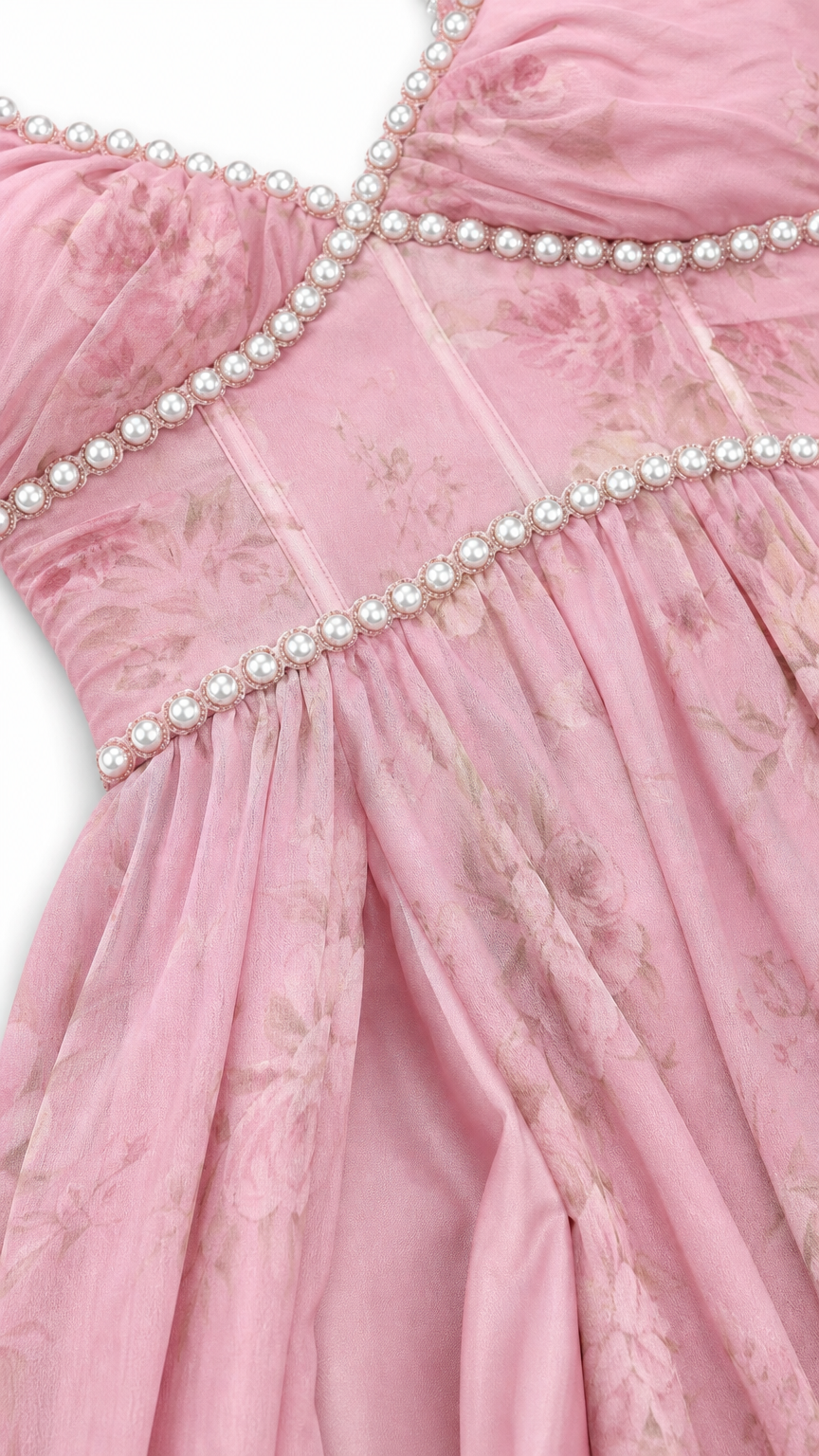 Close-up detail of faux pearl beading on bodice and neckline of pink dress