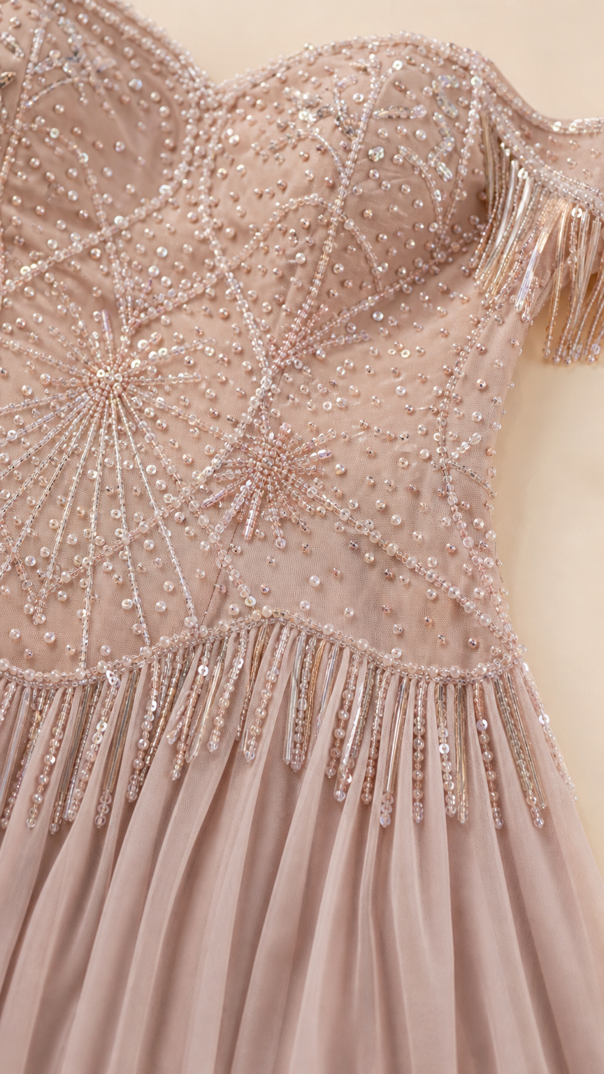 Close-up detail shot of the beaded bodice and sparkly sequin starburst pattern