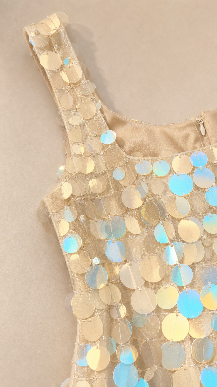 Close-up detail of square neckline and iridescent sequins