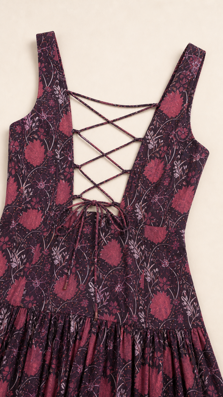 Close-up of the lace-up back and fabric pattern on the burgundy maxi dress