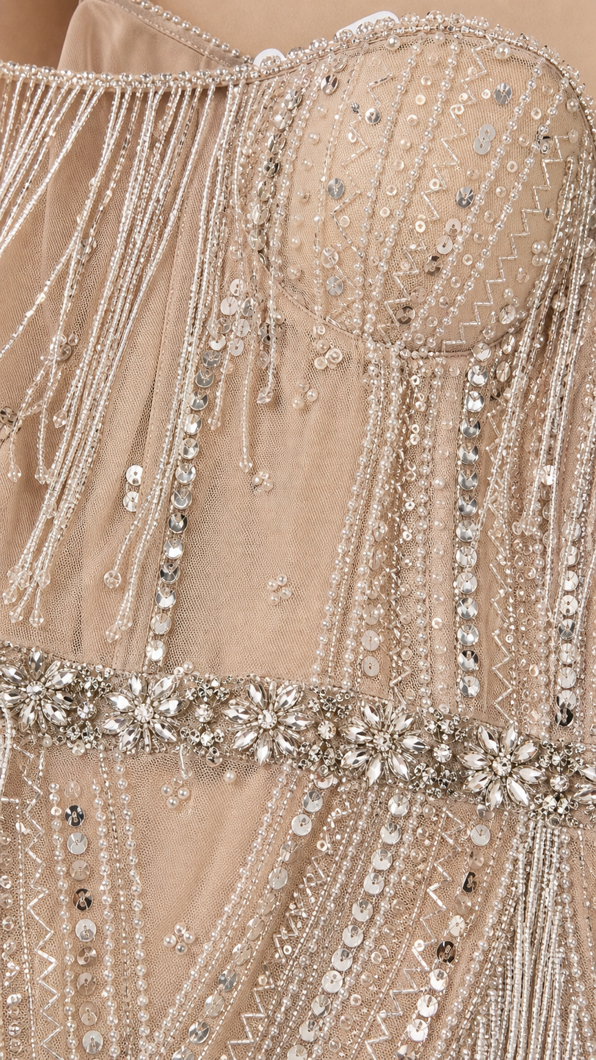 Close-up detail of bodice beadwork, sequins, and crystal waist belt