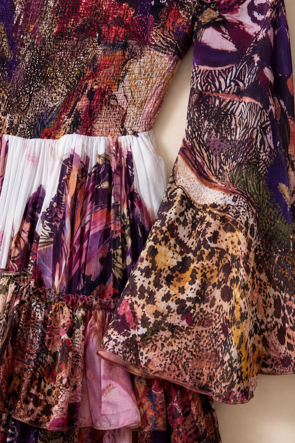 Close-up detail of smocked bodice and printed bell sleeve