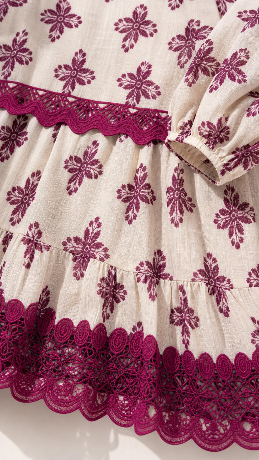 Close-up detail of embroidered hem and fabric texture