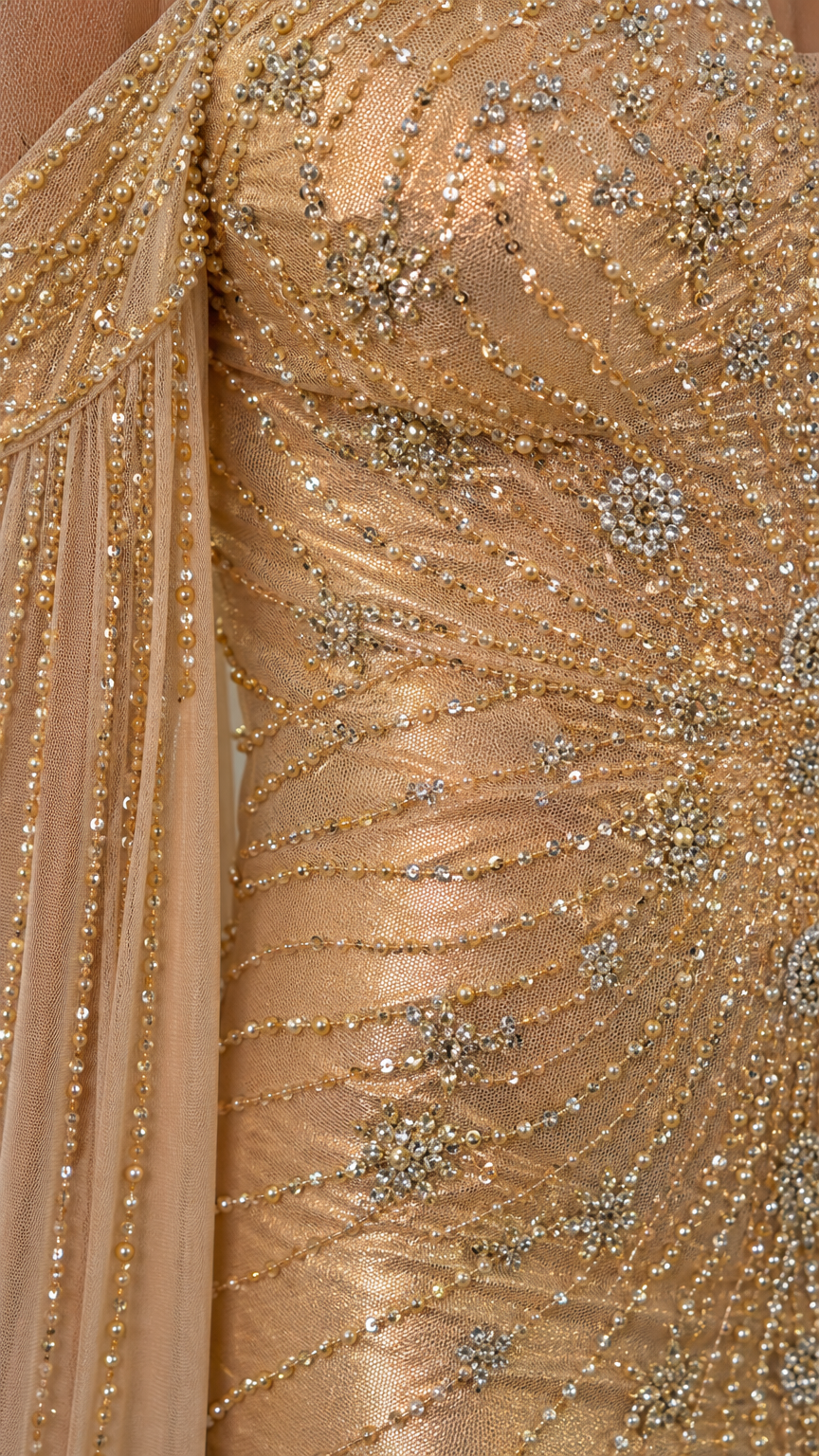 Close-up detail of beadwork and sequins on the dress