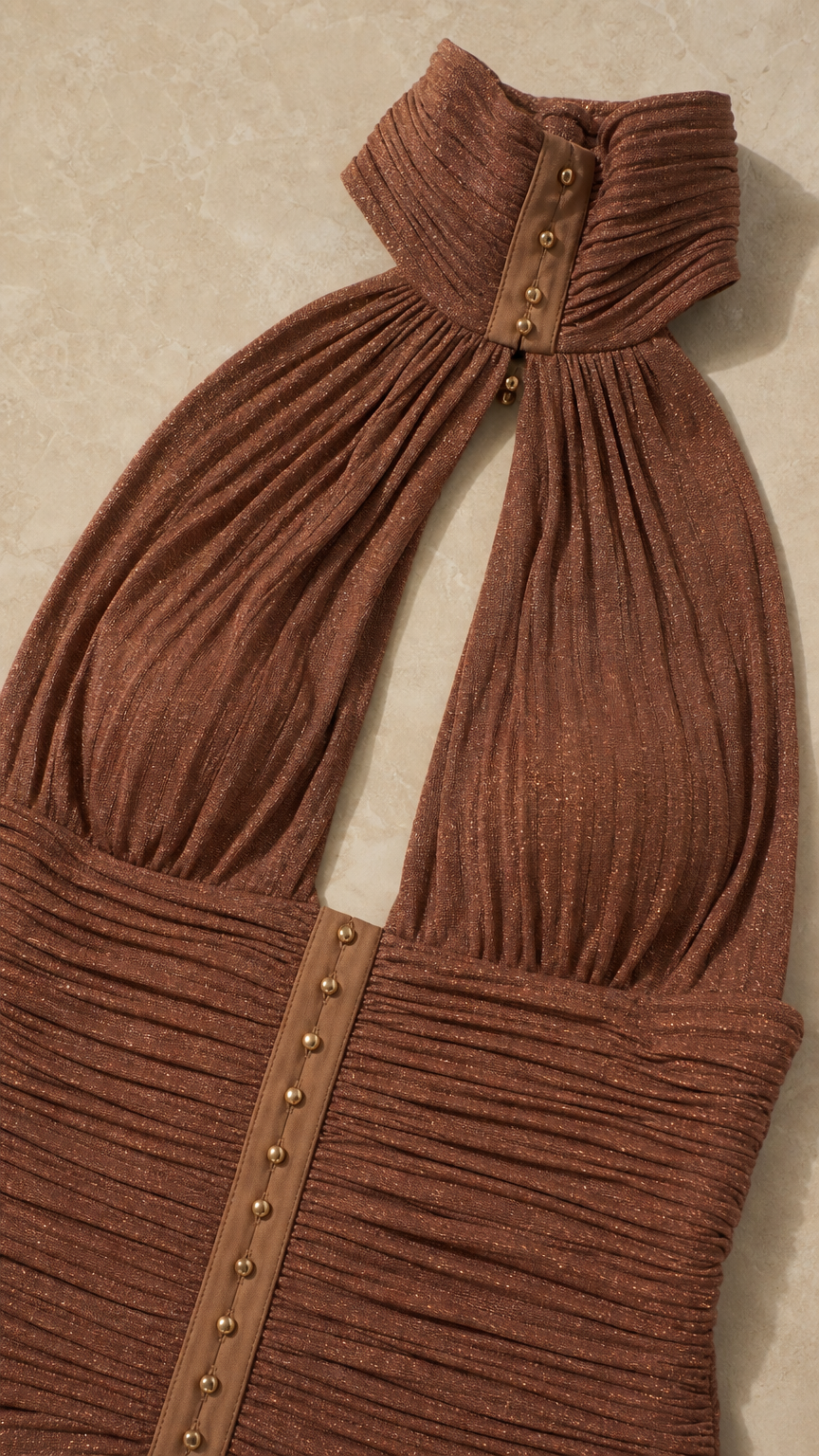 Close-up detail of the halter collar and ruched bodice