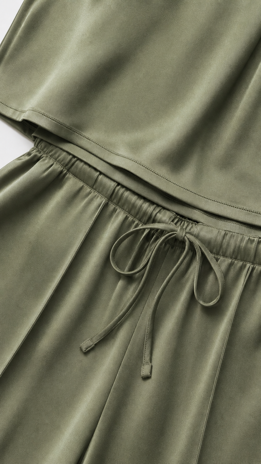 Close-up detail of Olive Green satin fabric, elastic waistband, and drawstring tie