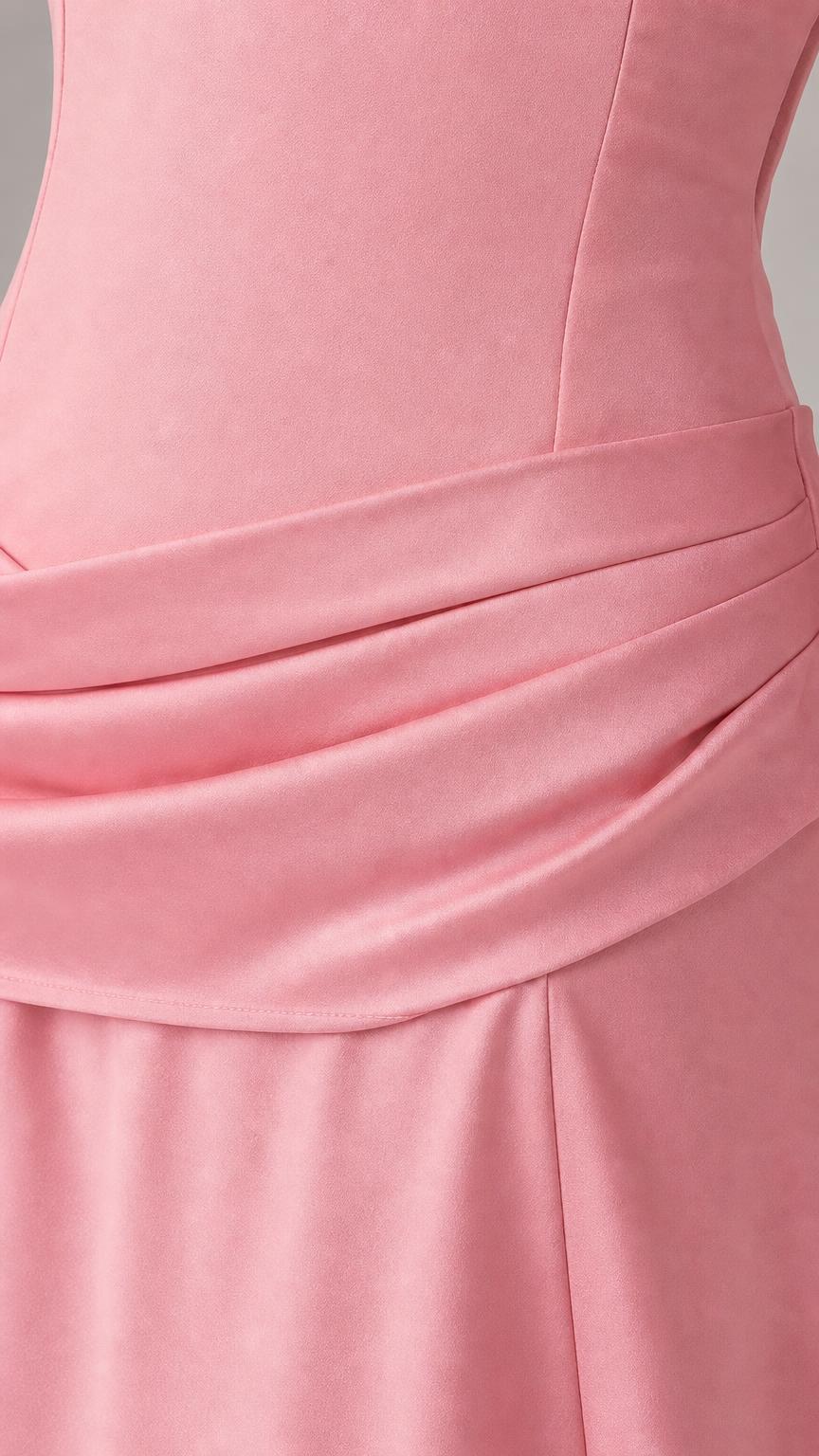 Close-up detail of draped drop-waist on pink dress