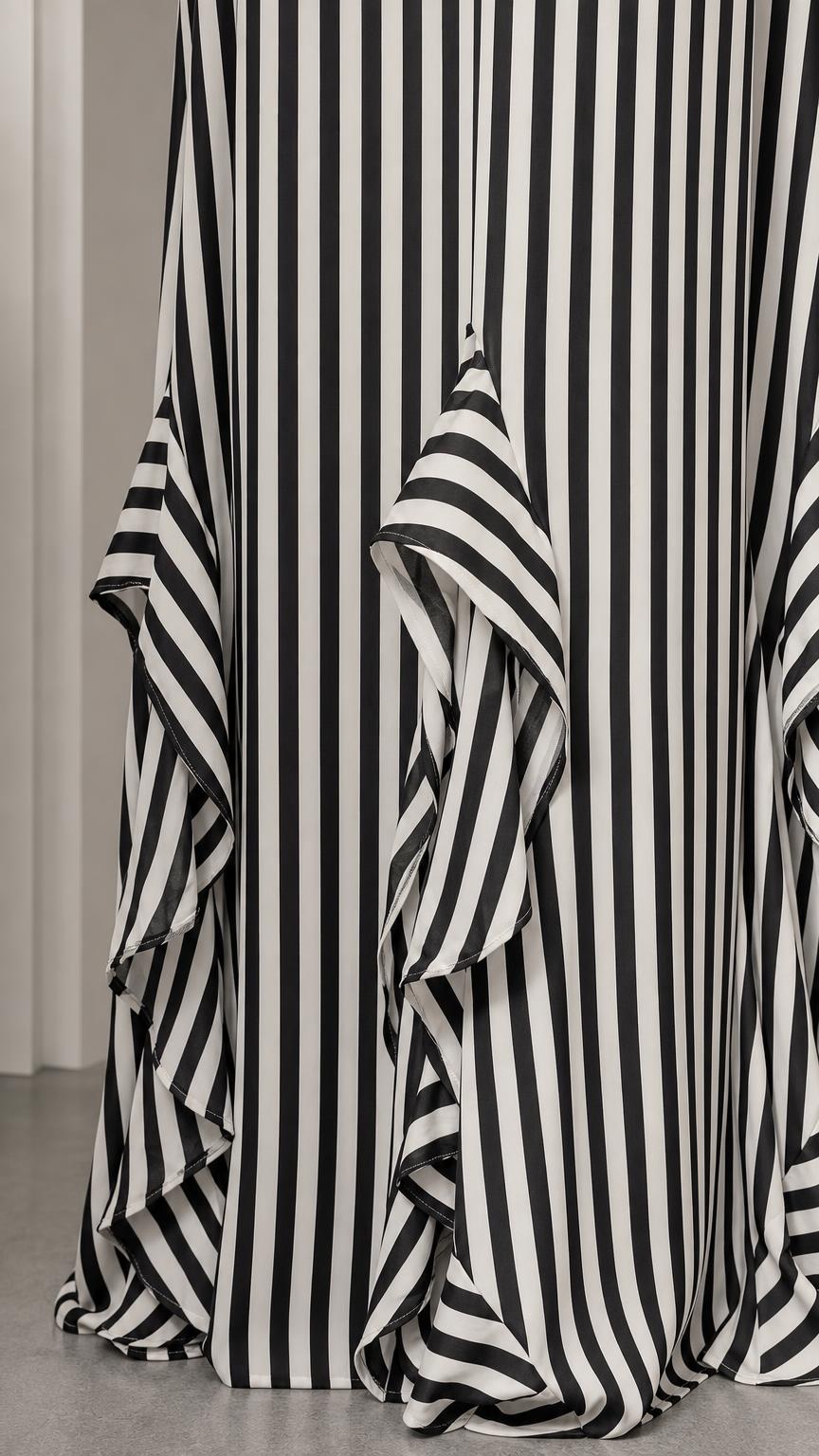 Close-up of bottom ruffle hem on striped maxi dress