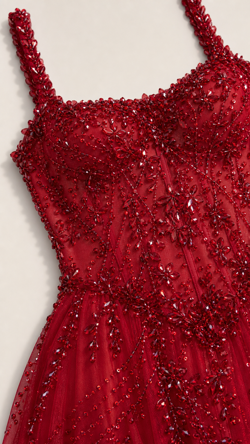 Close-up of bodice beadwork on red gown