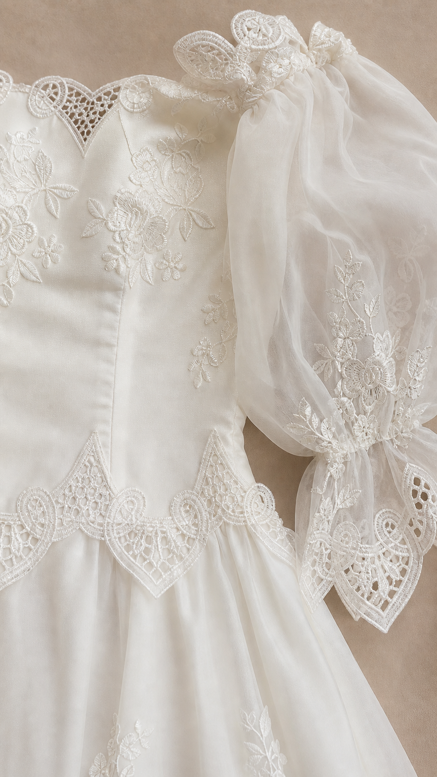 Close-up detail of bodice and puff sleeves on white dress