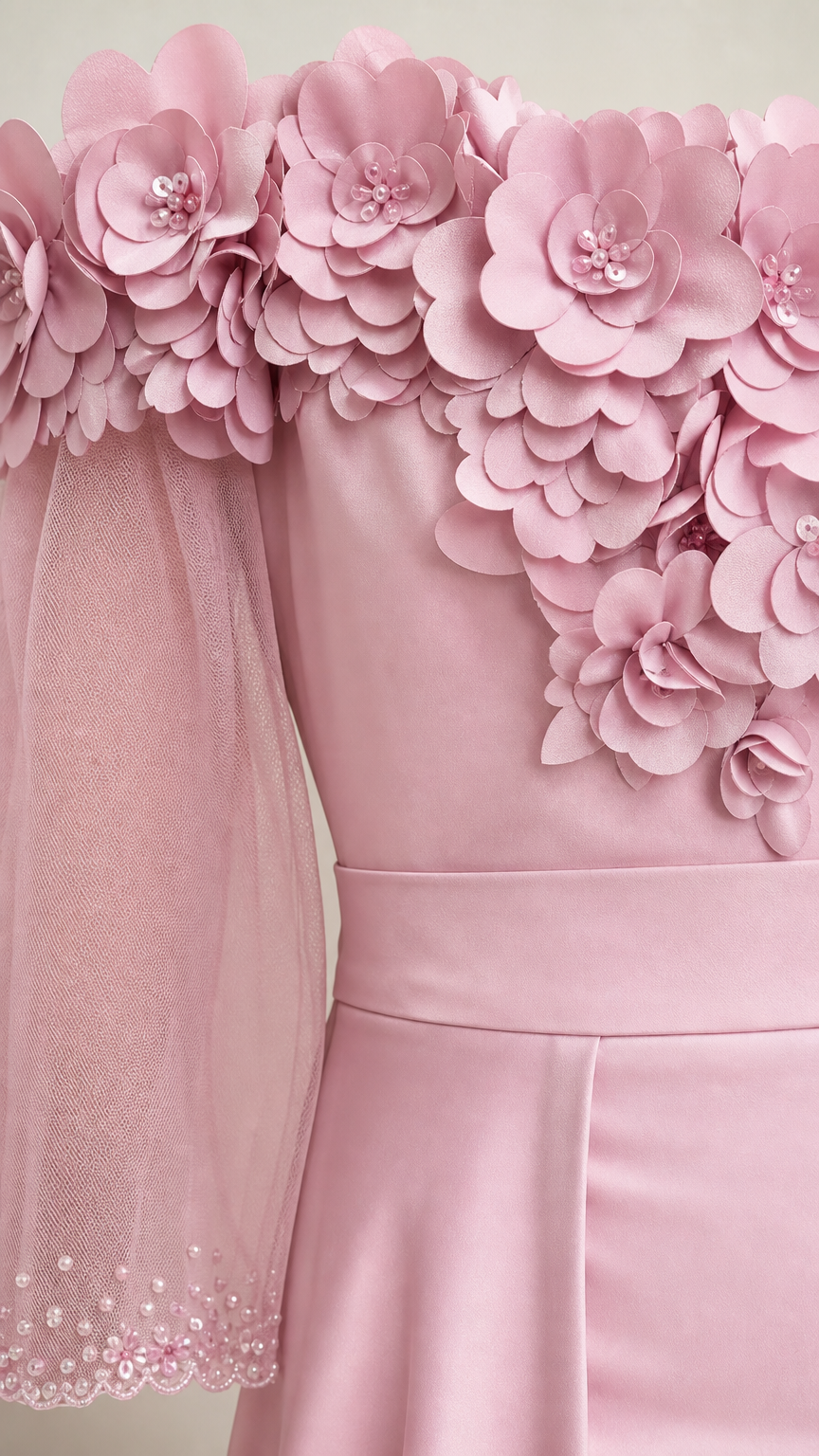 Close-up of 3D floral appliques and sheer sleeve